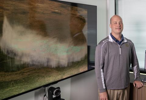 Researcher Michael Peterson with a visualization of the record lightning flash